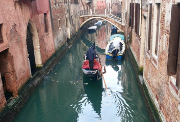 Fototapeta na wymiar Venetian gondola boat in Venice canal