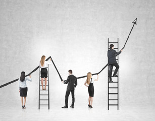 Rear view of a business team drawing a large black growing graph on a concrete wall. Some people are standing on ladders. Mock up - Powered by Adobe