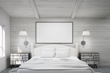 Double bed in a wooden room with poster