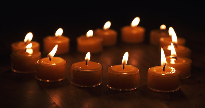 tealight candles in a shape of a heart 4k photo