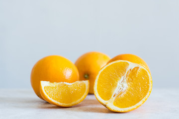 Orange fruit on white table. Shallow depth of field.