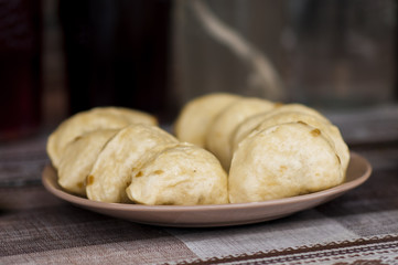 dumplings with potatoes and meat on plate
