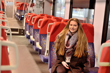 Young woman in a railway carriage.