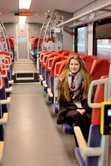 Young woman in a railway carriage.