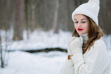 Pretty caucasian woman in a winter park