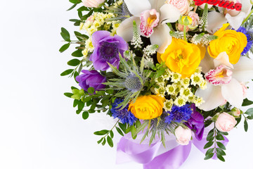 Bright buketny composition from fresh flowers, the white isolated background