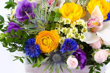 Bright buketny composition from fresh flowers, the white isolated background