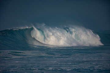 Huge waves crashing in ocean. Seascape environment background. Water texture with foam and splashes. Hawaiian surfing spots with nobody