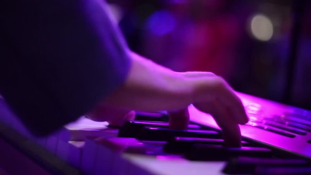 male hands playing the synthesizer