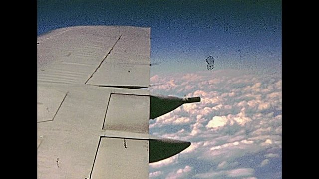 Vintage United States on 1970 about the point of view of a passenger landing by plane at John Fitzgerald Kennedy International Airport JFK, in 70's. Aerial view panorama of New York by airplane.