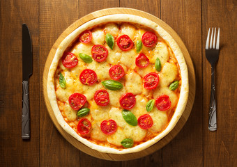 pizza at wooden table