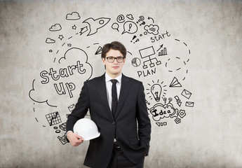 Man in hardhat, concrete wall, start up icons