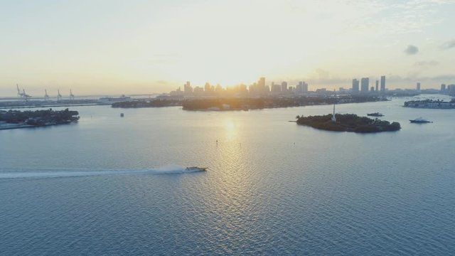 Miami Biscayne Bay Speedboat Across Water Port Of Miami Dade And City Downtown At Sunset
