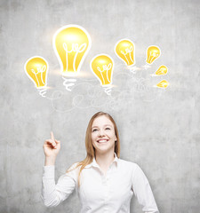Happy woman and light bulbs