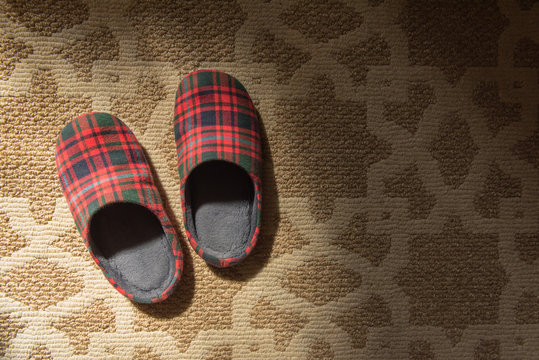 Cloth slipper on carpet