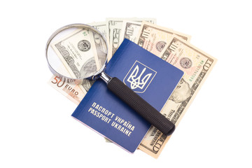 Passport, money and magnifying glass