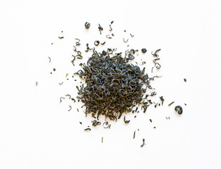 Stacks of spilled green tea leaves