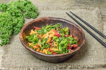 Fresh healthy raw nutritional salad with organic curly kale gree