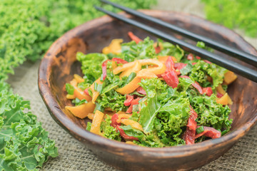 Fresh healthy raw nutritional salad with organic curly kale gree