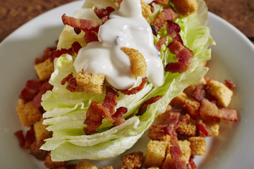 A classic wedge salad with ranch dressing and croutons