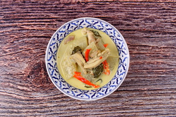 Green chicken curry in coconut milk with winter melon .