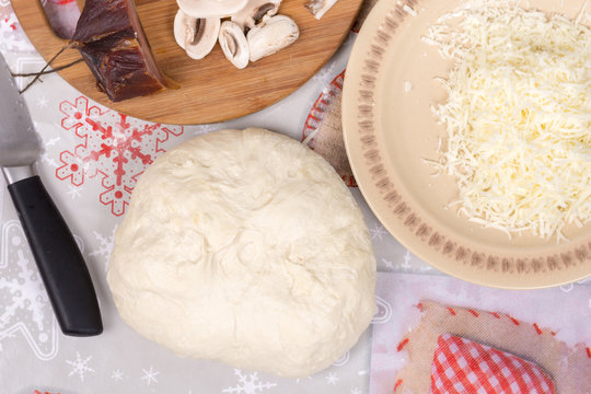 Preparing pizza dough mushrooms and meat