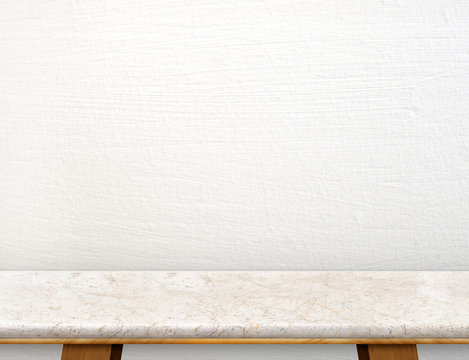 Empty cream marble table top with white concrete wall,Mock up fo