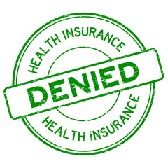 Grunge green health insurance denied round rubber stamp on white