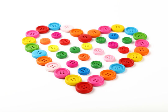 Heart Shaped Of Colorful Sewing Buttons On White