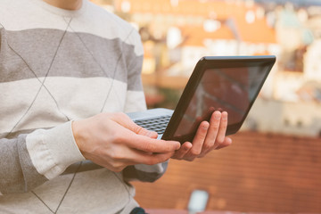 Adult male works on the computer.