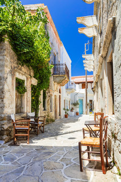 Fototapeta Authentic traditional Greece - cute street tavernas, Naxos island