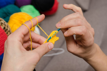 Close-up of hands knitting