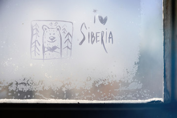 Inscription on the frosty glass - I love Siberia