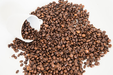Coffee beans with cup and on white backgrounf