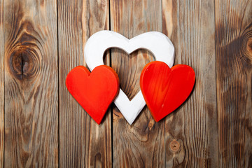 Holidays gift and heart on wooden rustic background. Valentines day