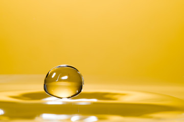 High speed macro from a waterdrop, splashing back again in the water, creating figurine like glass sculptures.