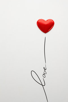 Just love / Creative valentines concept photo of heart with love sign on grey background.