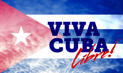 Flag of Cuba on cloudy blue sky with inscription Viva Cuba Libre