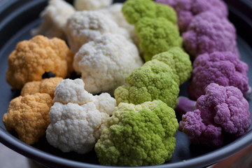  four colors of cauliflowers in a tray