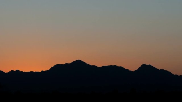 Sunrise time lapse at mountain range close up
