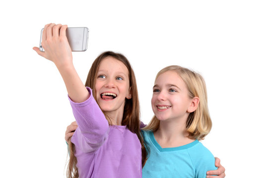 two girls taking a selfie white background