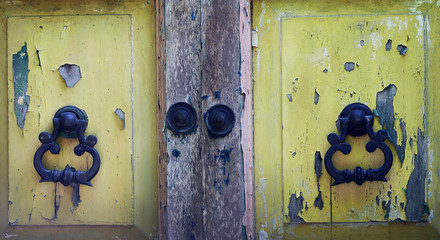 old vintage wooden doors and metal door handles