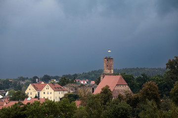 Hilpoltstein with castle ruin under stormy sky