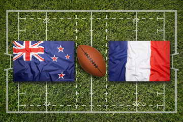 New Zealand vs. France flags on rugby field