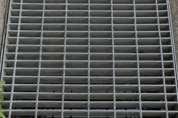 Metal grate detail. Black and white image.