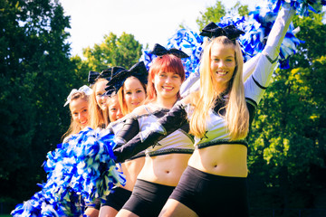 Cheerleaders Practicing Outdoors