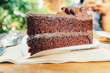 Dark chocolate cake on wooden