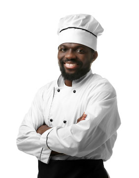 African American chef in uniform on white background