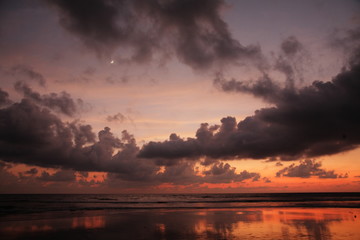 maldives beach sunset with moon and clouds