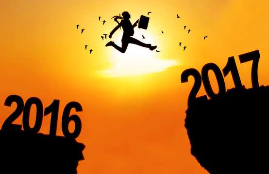 Businesswoman jump between 2016 and 2017
